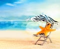 Beach chair with starfish under umbrella on the beach Royalty Free Stock Photo