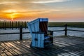 Beach chair at sunset on the North Sea Royalty Free Stock Photo
