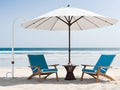 Beach chair and umbrella in summer sunny day Royalty Free Stock Photo