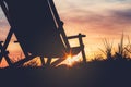 Beach chair under sunset on vacation Royalty Free Stock Photo