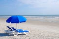 Beach Chairs with Blue Umbrella Royalty Free Stock Photo
