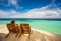 Beach chairs, clear water and beautiful view on tropical island,