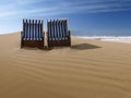 Beach chairs on a deserted sand dune Royalty Free Stock Photo