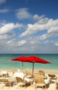 Beach chairs and red umbrella Royalty Free Stock Photo