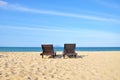 Beach chairs on sand beach. Concept for rest, relaxation, holidays, spa, resort with copy space area.