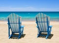 Beach Chairs on the sand with seawater background Royalty Free Stock Photo