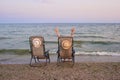 Beach chairs with sea as background. Royalty Free Stock Photo