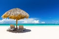 Beach chairs with umbrella and beautiful sand beach