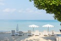 Beach chairs with umbrella with blue sky