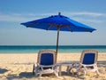 Beach Chairs and Umbrella by the Sea