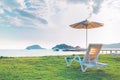 Beach chairs and beach umbrellas are on the lawn at the beach.Sea view, Royalty Free Stock Photo