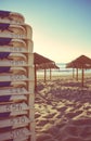 Beach chairs and wooden umbrellas in empty beach Royalty Free Stock Photo