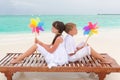 Beach children with pinwheels