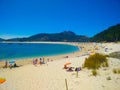 Beach of Cies Islands, in Galicia, Spain, with boats docked in f Royalty Free Stock Photo