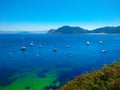 Beach of Cies Islands, in Galicia, Spain, with boats docked in f Royalty Free Stock Photo