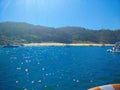 Beach of Cies Islands, in Galicia, Spain, with boats docked in f Royalty Free Stock Photo