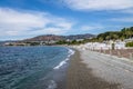 Beach in and city view at waterfront promenade lungomare - Reggio Calabria, Italy