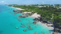 Beach and clear water of the Caribbean. Reefs and the ocean aerial view.