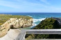 Beach with cliff, waves and wooden boardwalk. Lugo, Spain. Royalty Free Stock Photo