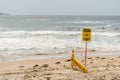 Beach closed sign and surf rescue board at the beach in Sydney Royalty Free Stock Photo