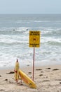 Beach closed sign and surf rescue board at the beach in Sydney Royalty Free Stock Photo