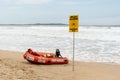 Beach closed sign and surf rescue boat at the beach in Sydney. Royalty Free Stock Photo