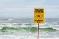 Beach closed sign for swimmers at the beach in Australia. Dangerous current and high waves Royalty Free Stock Photo