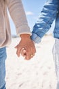 Beach, closeup and couple holding hands for love, commitment and marriage in nature. Travel, bonding and man and woman Royalty Free Stock Photo