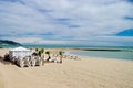 Beach and beach club in Mediterranean beach in Sitges, Spain during a cloudy day