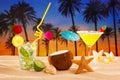 Beach cocktail sunset on palm tree sand mojito margarita Royalty Free Stock Photo