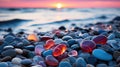 Beach with color pebbles in the sea coast, in the background sea and waves with sunset and sky. Sunset over a rocky beach Royalty Free Stock Photo