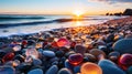 Beach with color pebbles in the sea coast, in the background sea and waves with sunset and sky Royalty Free Stock Photo