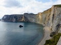 Beach with colored cliff overlooking the sea to Ponza in Italy.
