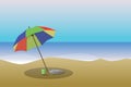 A beach with a colorful parasol