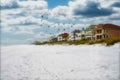 Beach condos on Florida coast sand birds and clouds