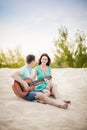 Beach, couple, guitar, sand