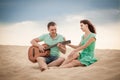 Beach, couple, guitar, sand