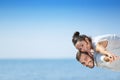 Beach couple laughing in love romance on travel honeymoon vacation Royalty Free Stock Photo