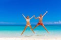 Beach couple looking. Happy young couple lying on sand under sun Royalty Free Stock Photo