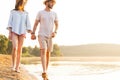 Beach couple walking on romantic travel honeymoon vacation summer. Royalty Free Stock Photo