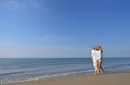 Beach couple walking on romantic travel honeymoon vacation summer holidays romance. Royalty Free Stock Photo