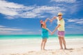 Beach couple walking on romantic travel honeymoon vacation summer holidays romance. Young happy lovers, Cayo LArgo, Cuba Royalty Free Stock Photo