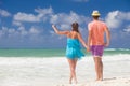 Beach couple walking on romantic travel honeymoon vacation summer holidays romance. Young happy lovers, Cayo Largo, Cuba Royalty Free Stock Photo