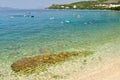 Beach with crystal clear sea and people in Tucepi, Croatia Royalty Free Stock Photo
