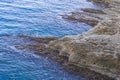 Beach, crystal clear water in Mediterranean sea near to cliff. Kemer, Turkey