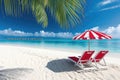Beach deck chair with red umbrella on tropical sand beach in sunny sky background Royalty Free Stock Photo