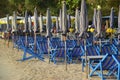 Beach deck chairs and umbrella in the morning at Cha-am Beach. Royalty Free Stock Photo