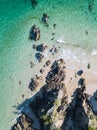 Beach drone shot with aqua waves and cliffs Royalty Free Stock Photo