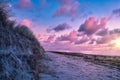 on the beach with dune on the Baltic Sea. Cloudy sky. Waves meet sand. Landscape Royalty Free Stock Photo