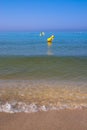 Beach edge waves and buoys